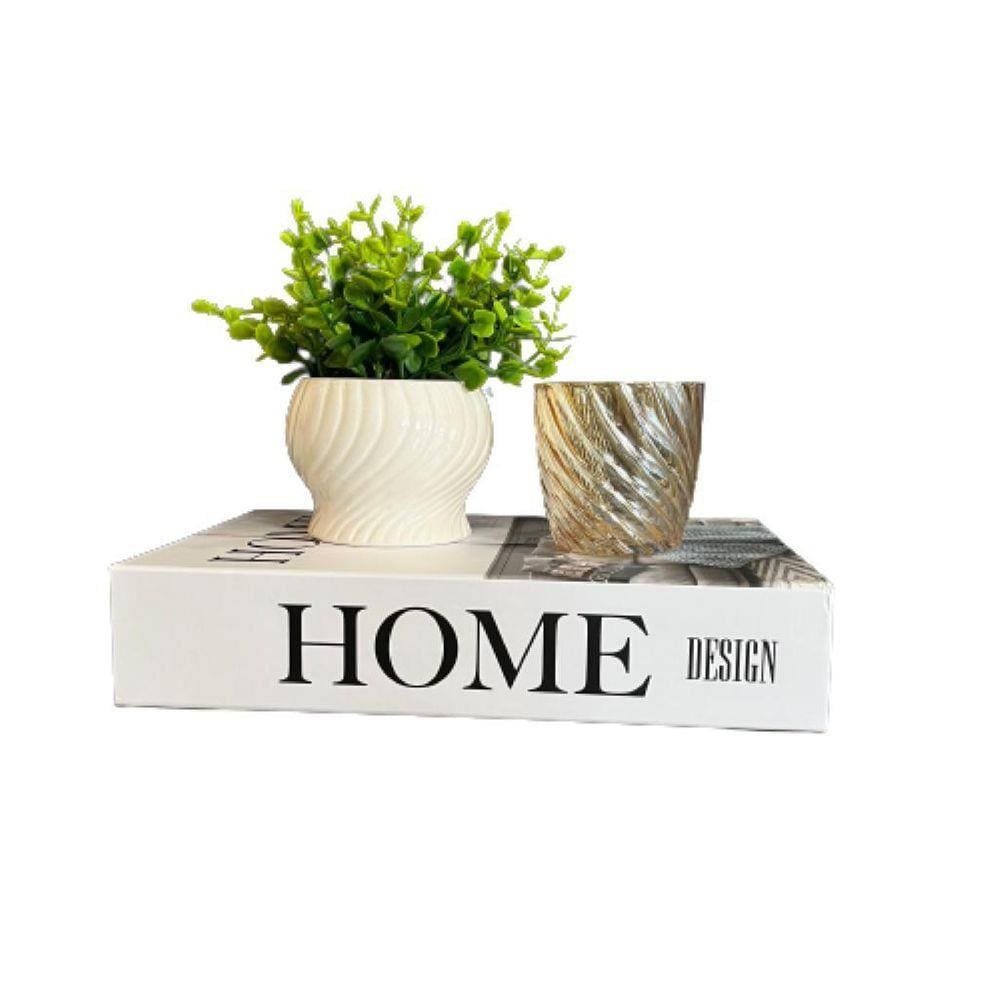 Livro de papelão, vaso branco cerâmico e castiçal de vidro