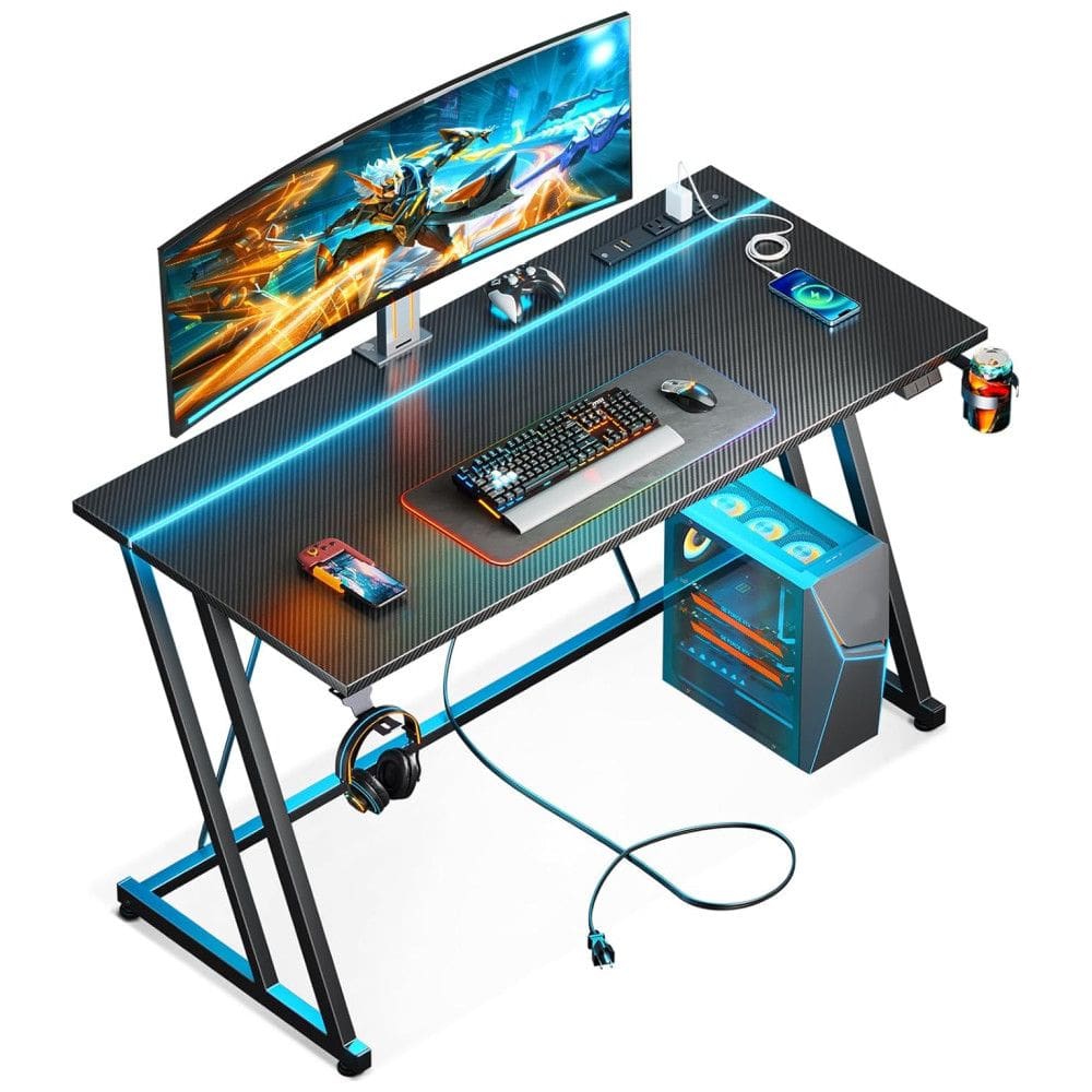 Mesa Gamer 47” 119 cm com Textura de Fibra de Carbono, Gancho para Fone de Ouvido, Tomadas, 1 Portas USB e Luz LED, 110V, MOTPK