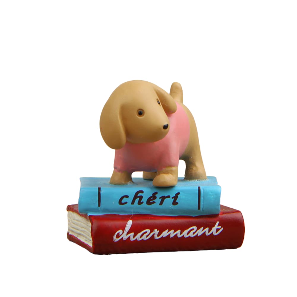 Estatueta de cachorro de resina fofa em livros coloridos para jardim