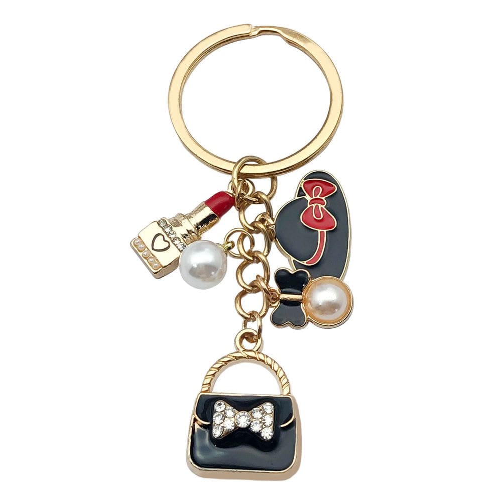 Chaveiro, bolsa preta e pingente de batom — acesso moderno para presentes